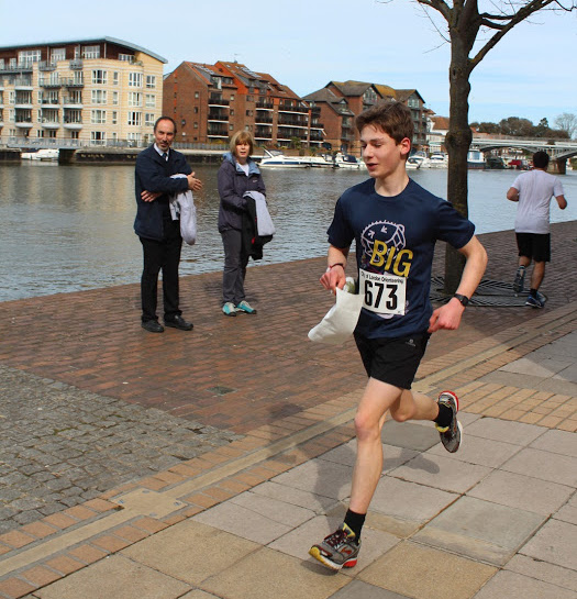 A runner catches the attention of passers-by on the riverside at the Kingston Urban Race. Photo courtesy of Mark Howells.